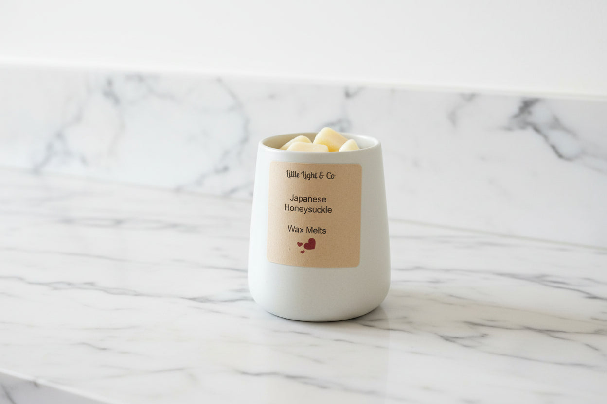 Large Jar of wax melts on a marble surface little light & co